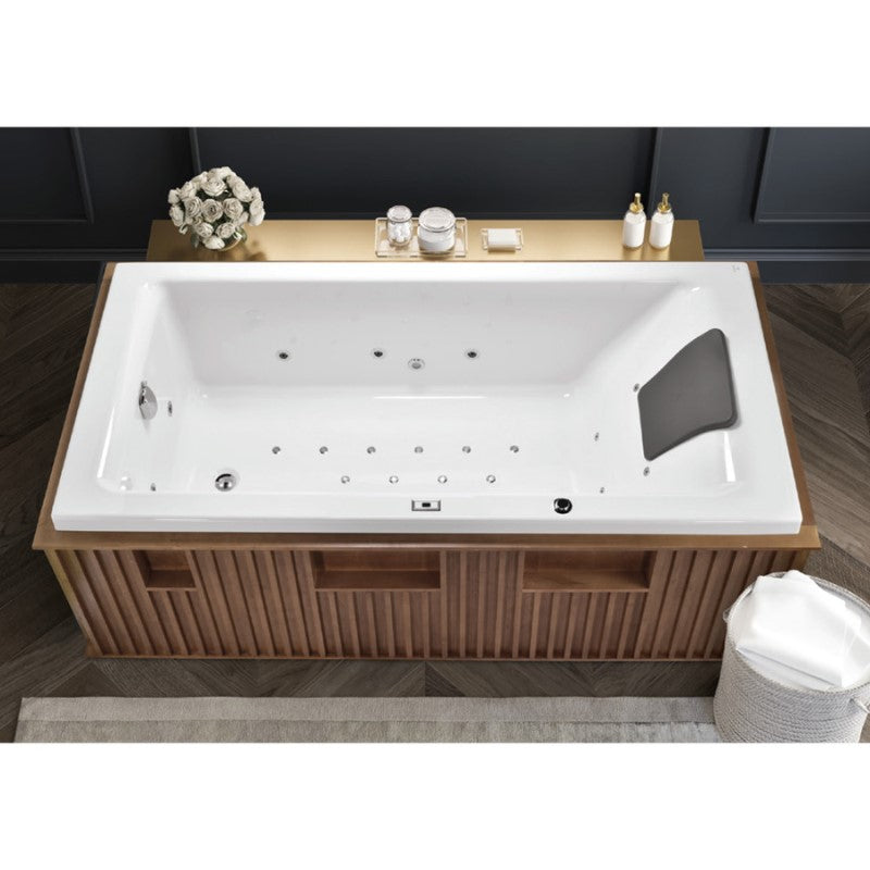 Artize Quadro Superior Whirlpool and Airpool Combi Bathtub. This is a lifestyle photo and shows you how the whirlpool bath can be set up. The bath has a head rest on the right hand side and a plug on the left hand side. With multiple jets around the tub.